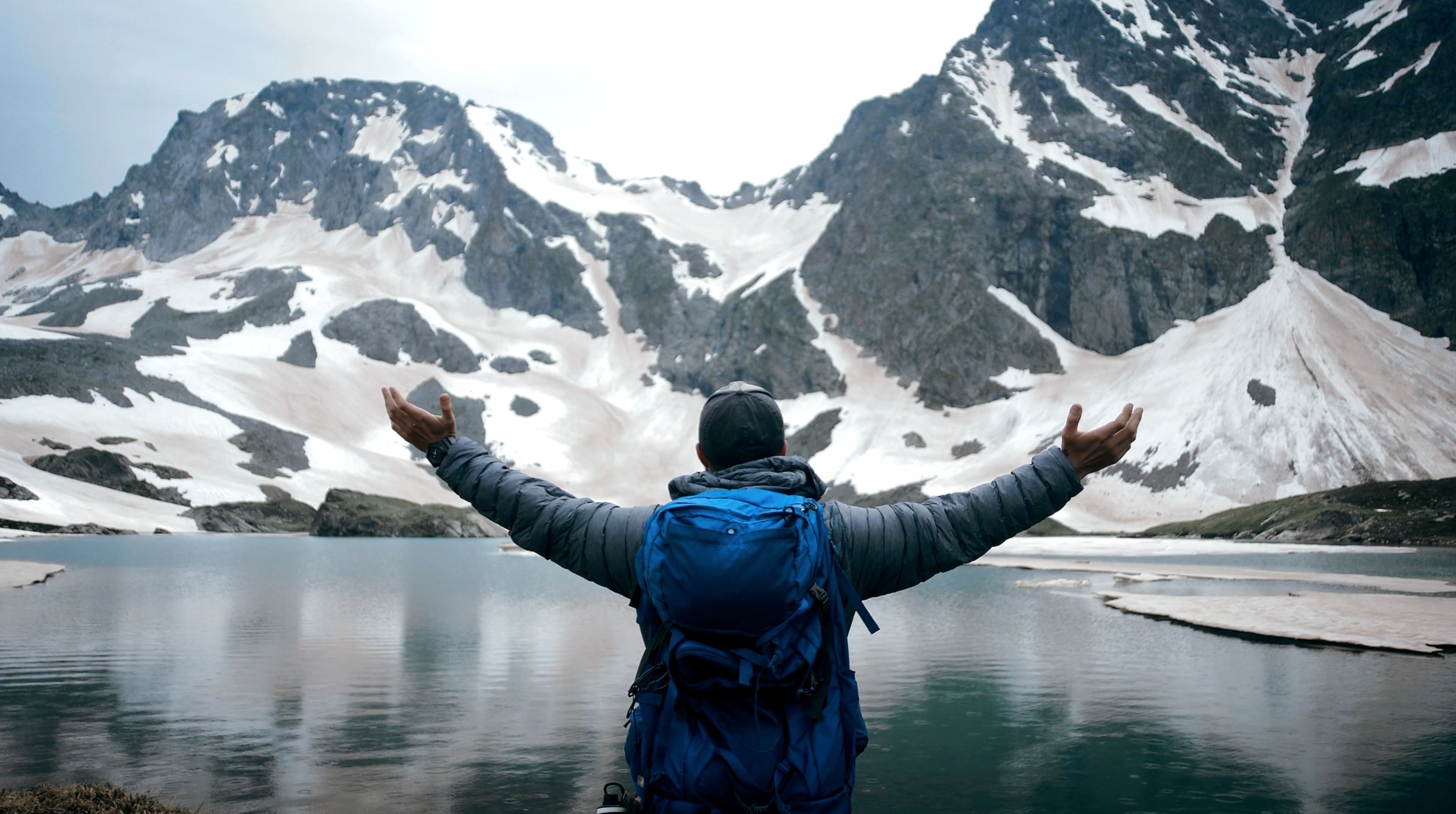 Man standing in front of mountains